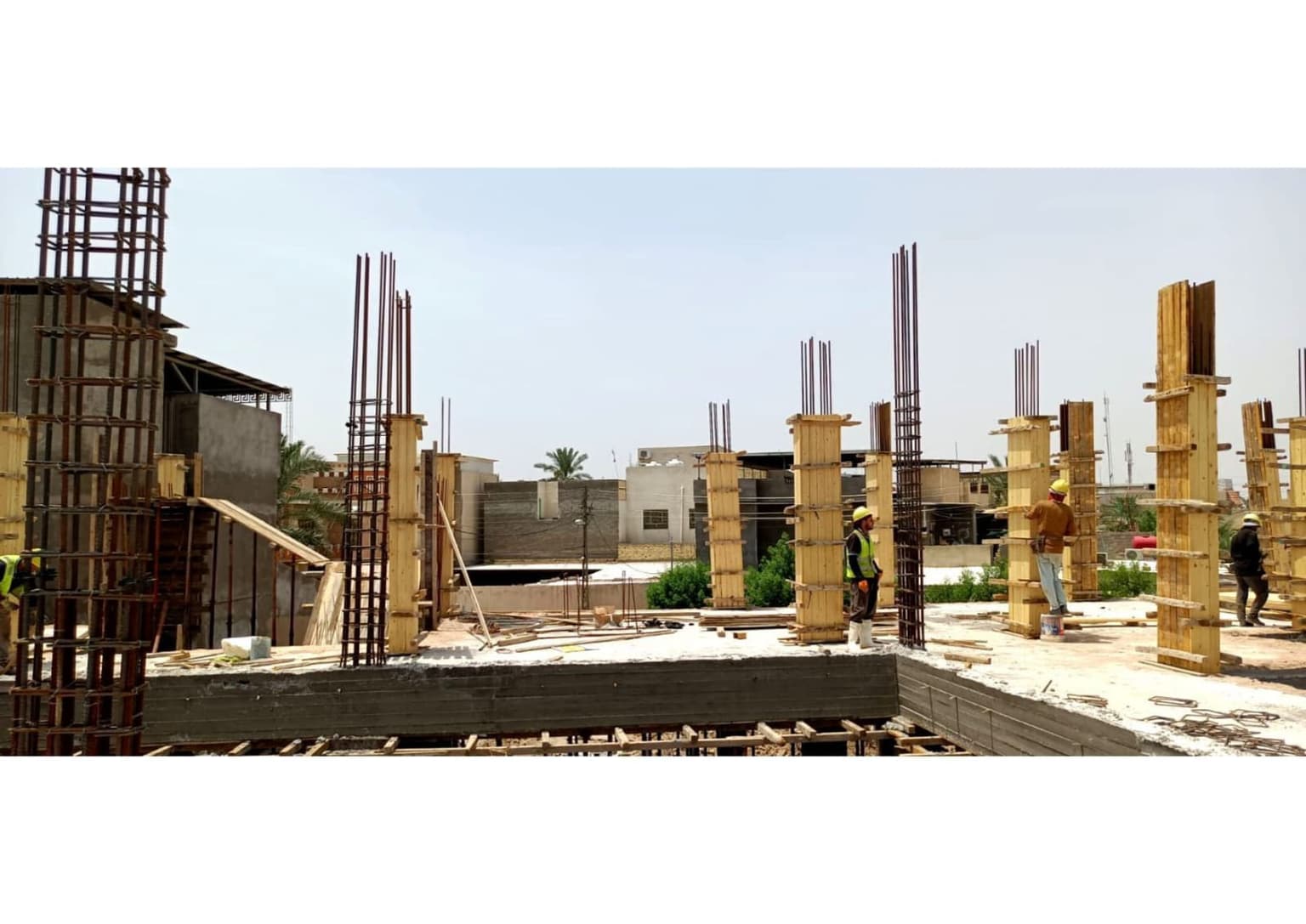 Workers erecting the concrete column formwork for the floor
